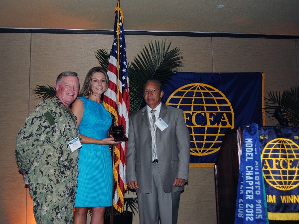 Capt. Slevin and Ramos present Mary Allison Yourchisin with the Meritorious Service Award in May.